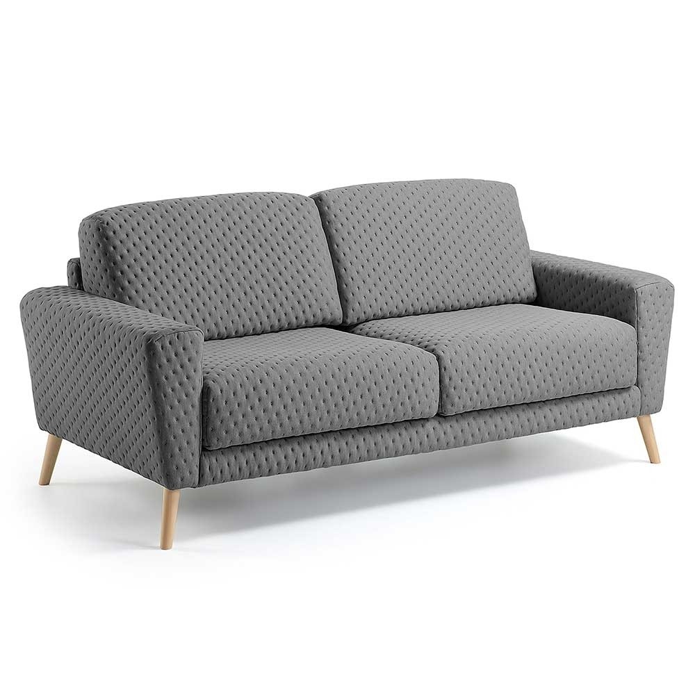 Graue Couch Volcma mit Holzbeinen in Natur.